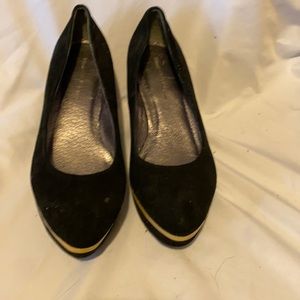 Black platform dress shoes with gold trim